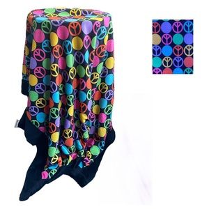 Terry cloth peace sign throw blanket. Black on one side and can be reversed.
